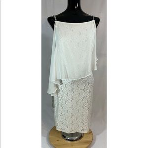 White mini dress with sheer sleeve.